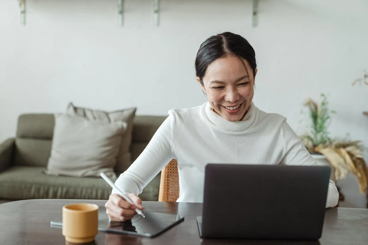 Entrepreneur reviewing financial documents on laptop
