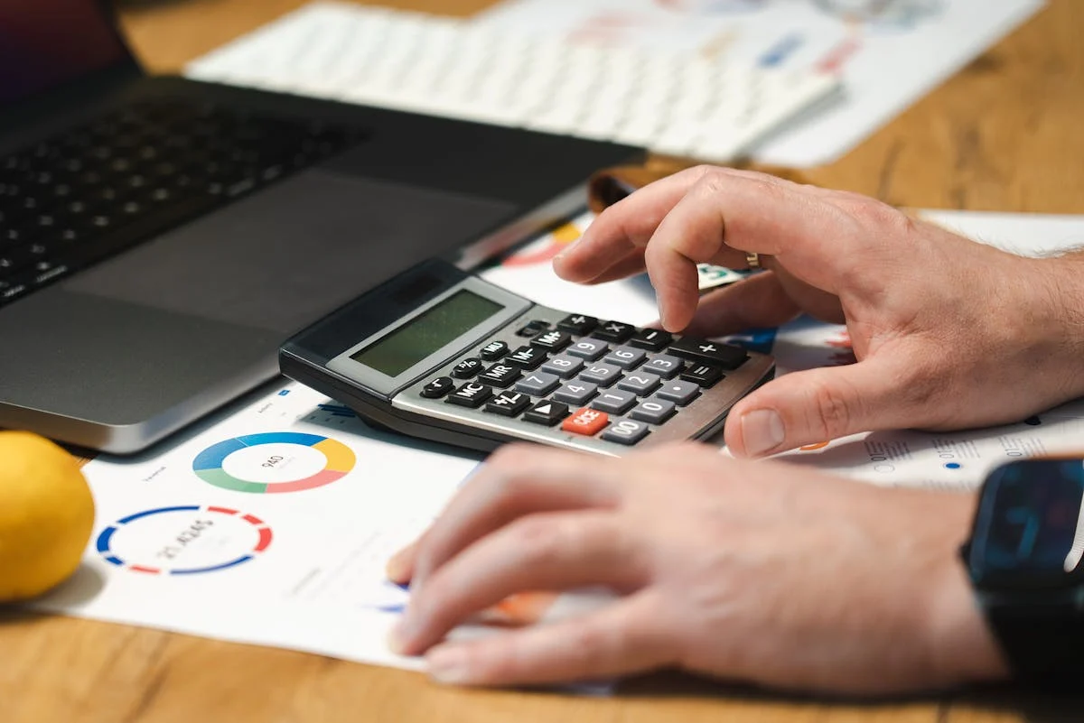 Organized financial workspace with calculator and documents